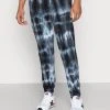 YOURTURN MONOCHROME TIE DYE JOGGER UNISEX - Pantaloni Sportivi - Black/off White -Sconto YOURTURN in Italia 0edc31c01d024468a27152acd4fe8944